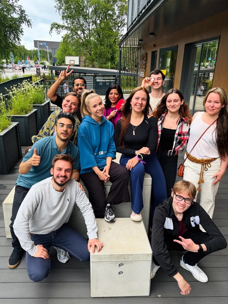 Stay Larsen residents gathered outside Rocca House, one holding a ping-pong paddle and another a ball
